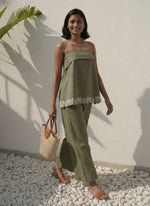 Load image into Gallery viewer, Olive green co-ord set on model standing with bag – versatile summer outfit for resort and daytime events