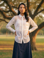Load image into Gallery viewer, Elegant white women’s shirt with navy bottoms, timeless summer travel and smart casual fashion style.