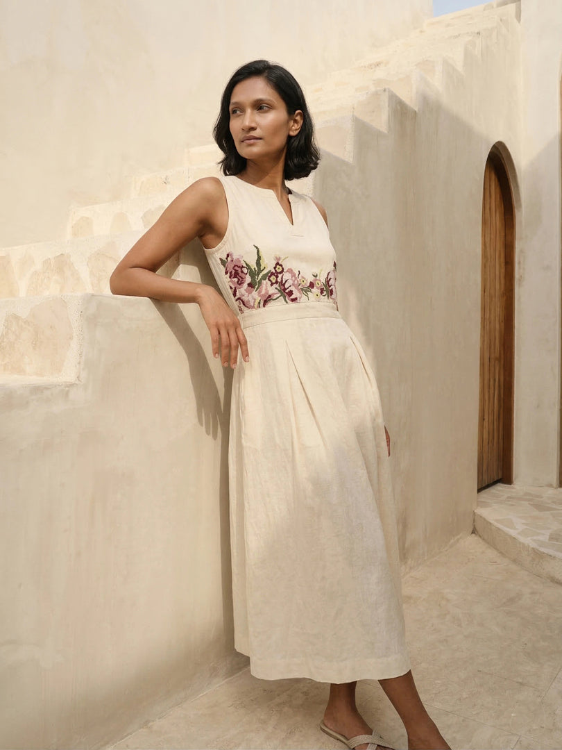 Side-front view of Celia Linen Midi dress in cream – lightweight sleeveless summer dress with tailored bust and relaxed skirt
