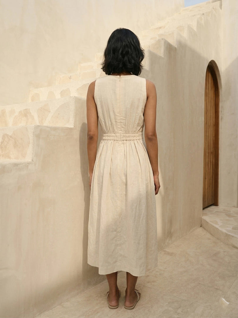 Back view of Celia Linen Midi cream dress – structured linen sleeveless A-line dress for casual and semi-formal day events