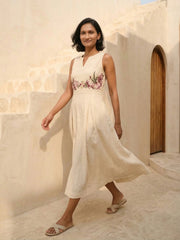 Front view of Celia Linen Midi dress for women in cream with hand-embroidered floral cross-stitch – sleeveless summer A-line midi dress