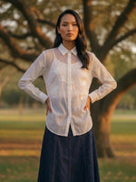 Load image into Gallery viewer, Breathable women’s white collared top with flowy blue pants, smart casual travel outfit.