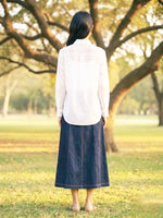 Load image into Gallery viewer, Stylish women’s white workwear shirt with dark blue trousers, versatile resort and casual outfit look.
