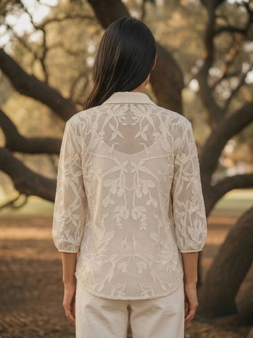 Back view of ivory openwork crochet summer lace shirt for women, floral embroidered white lace blouse rear design.